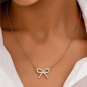 Gold bow necklace